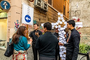  SEMINARIAN OFFERING TO PUT PRAYERS ONTO PIECES OF PAPER, ROME, ITALY, EUROPE